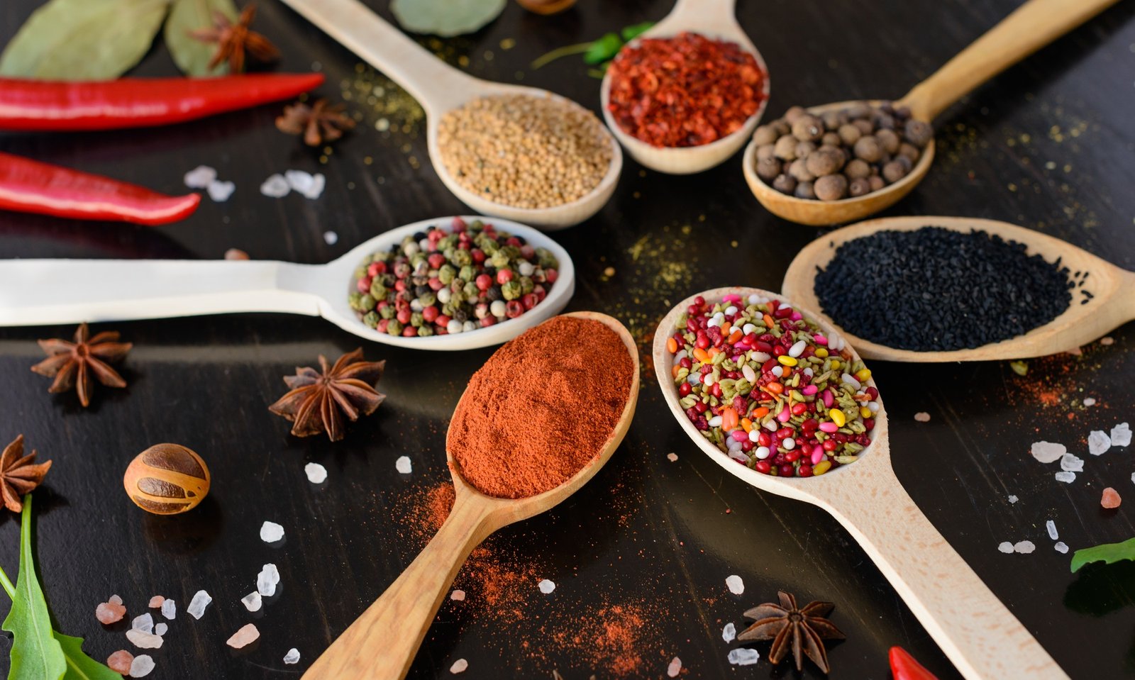 Spices and herbs on old kitchen table